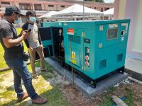 2 man looking at generator